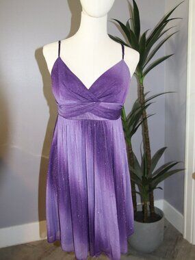 Purple knee-lentgh party dress.